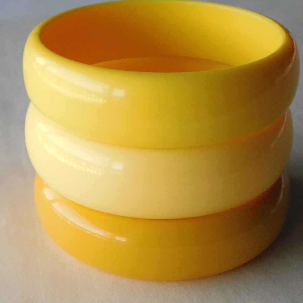 three chunky VINTAGE plastic yellow bangles